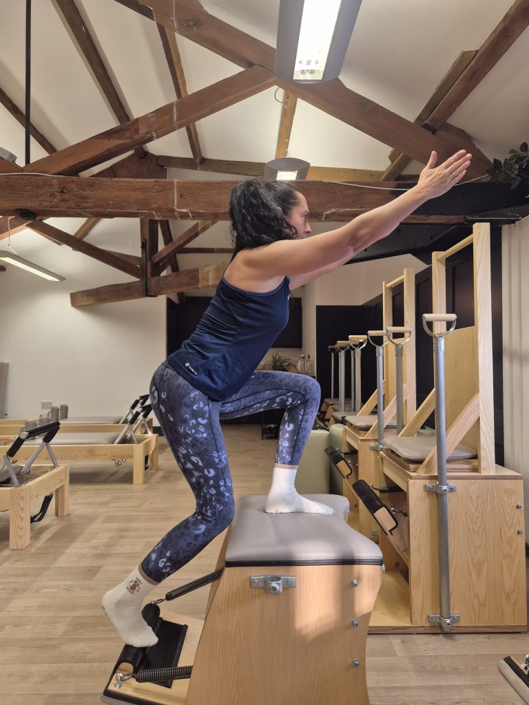 Head of teaching, Clare Axon-Saunders, demonstrating mountain climbers on the wunda chair